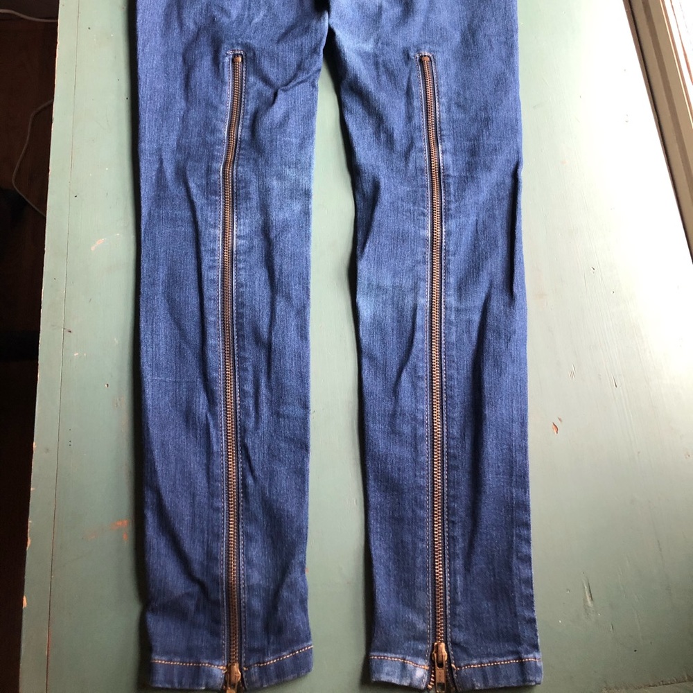 Skinny blue jeans with back leg zippers